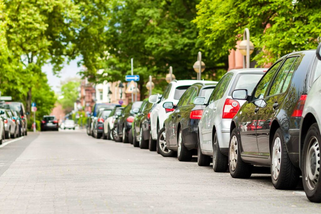 rows-of-cars-parked-on-the-roadside